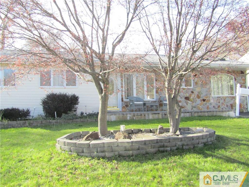 25 Brandeis Road Old Bridge, NJ 08859 - Photo 23 of 25 a front view of a house with garden
