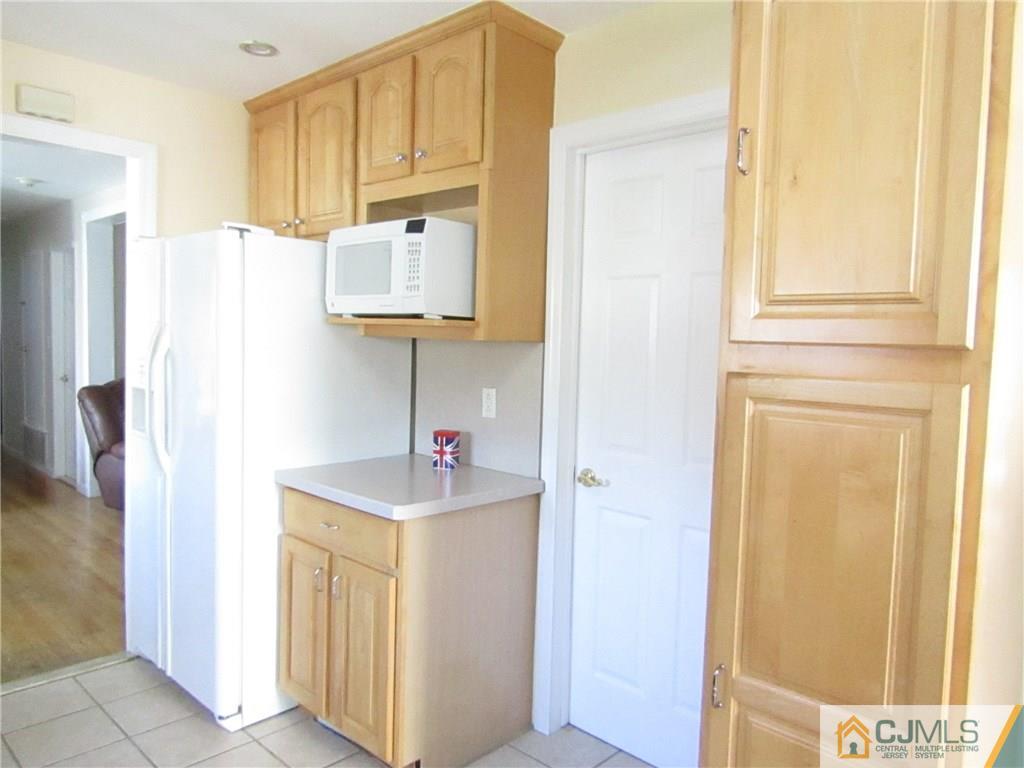 25 Brandeis Road Old Bridge, NJ 08859 - Photo 4 of 25 a bathroom with a sink and a mirror