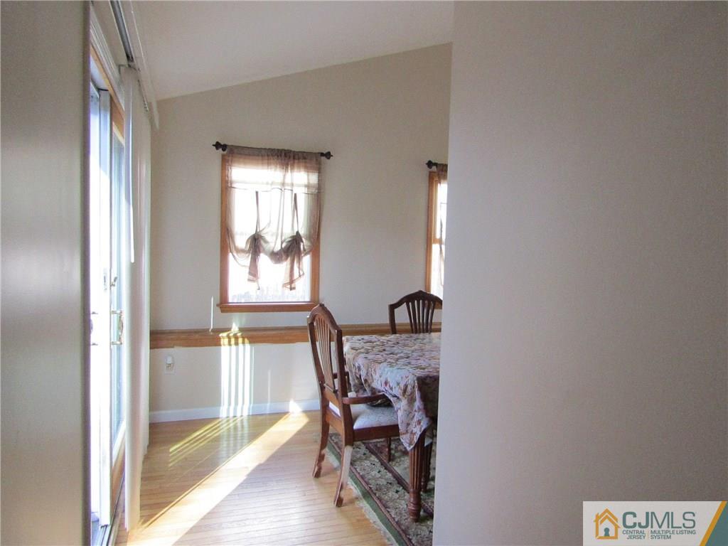 25 Brandeis Road Old Bridge, NJ 08859 - Photo 7 of 25 a view of a room that has a bed and chair