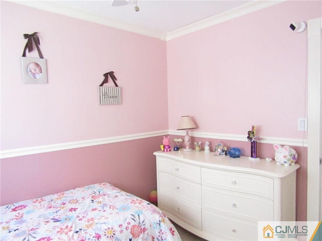 25 Brandeis Road Old Bridge, NJ 08859 - Photo 9 of 25 a bedroom with a bed and hallway