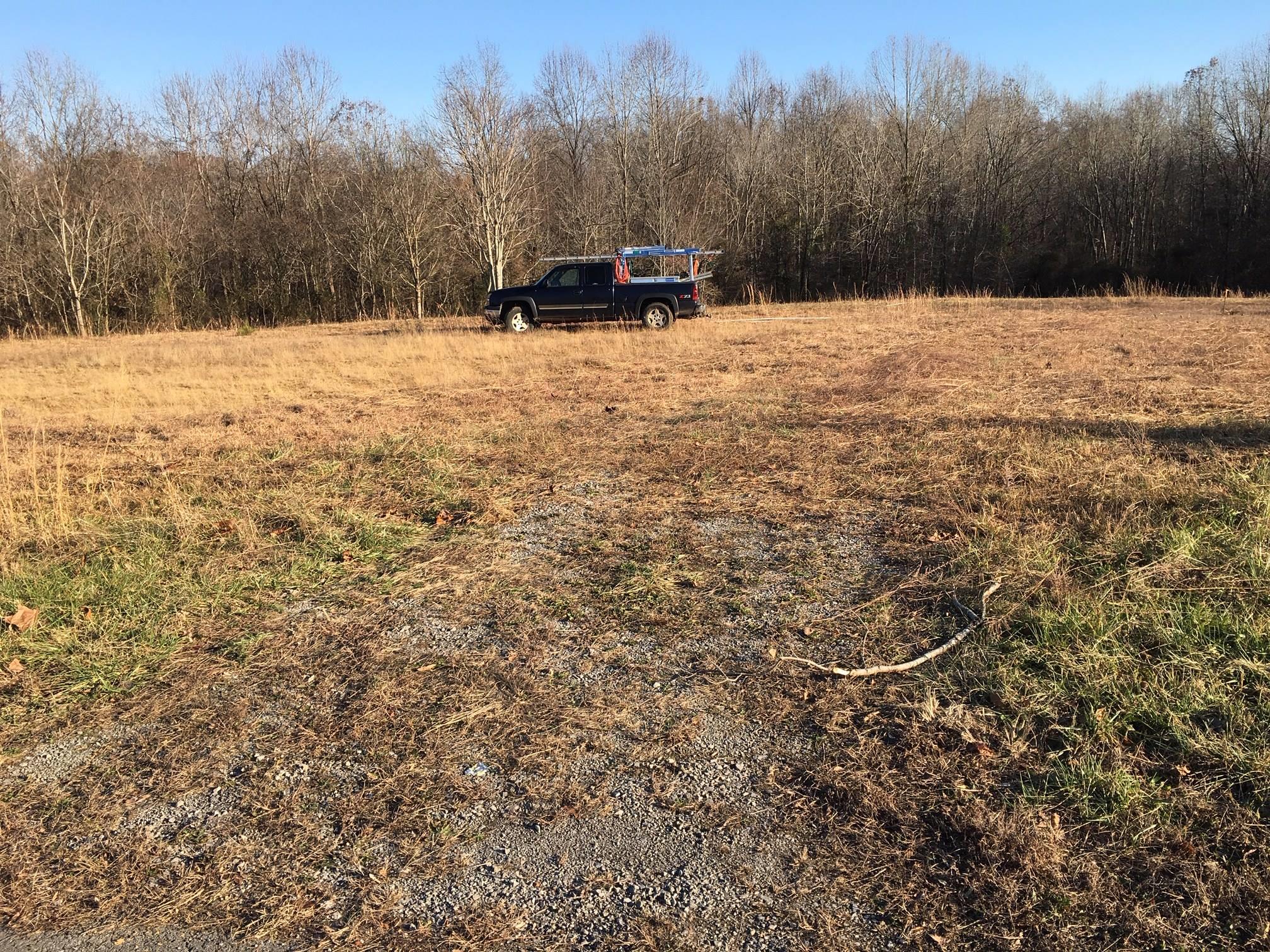 1 Lake Road Woodlawn, TN 37191 - Photo 2 of 3 Slight slope from the street until the woodline. Great place to build