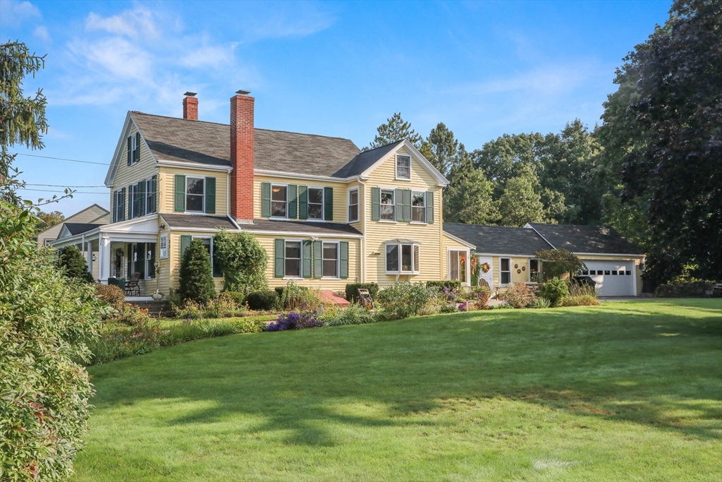 63 Ferry Road Salisbury, MA 01952 - Photo 1 of 42 a front view of a house with a garden