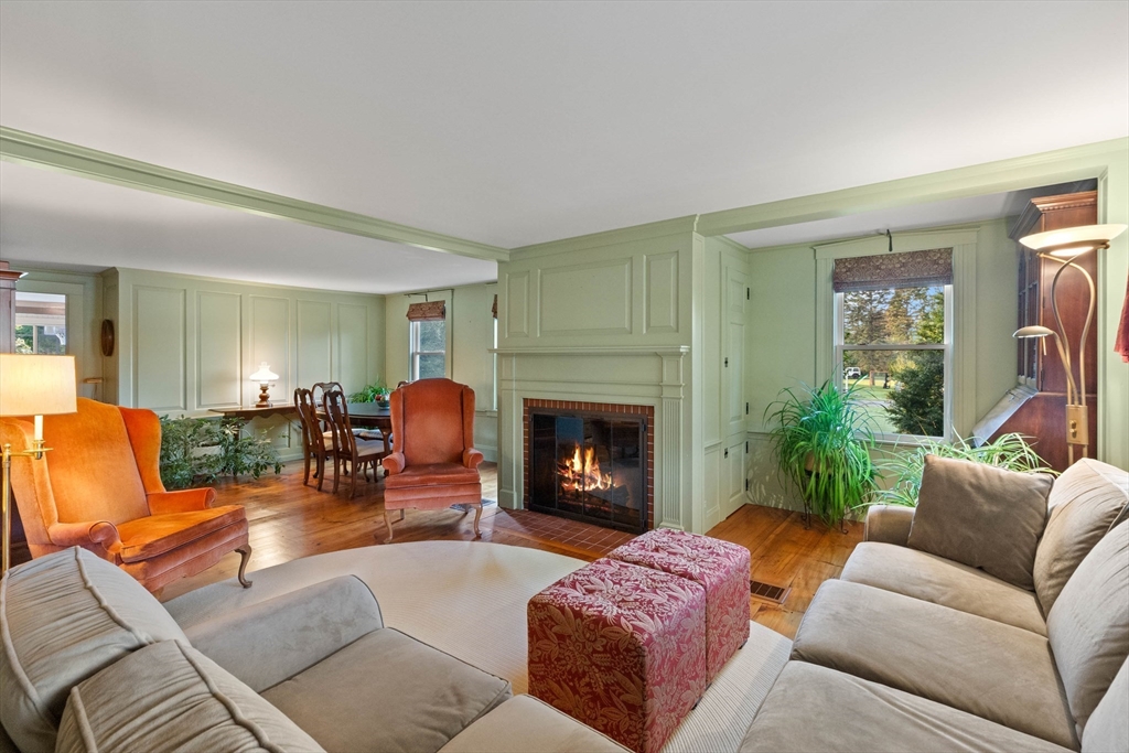 63 Ferry Road Salisbury, MA 01952 - Photo 12 of 42 a living room with furniture and a fireplace