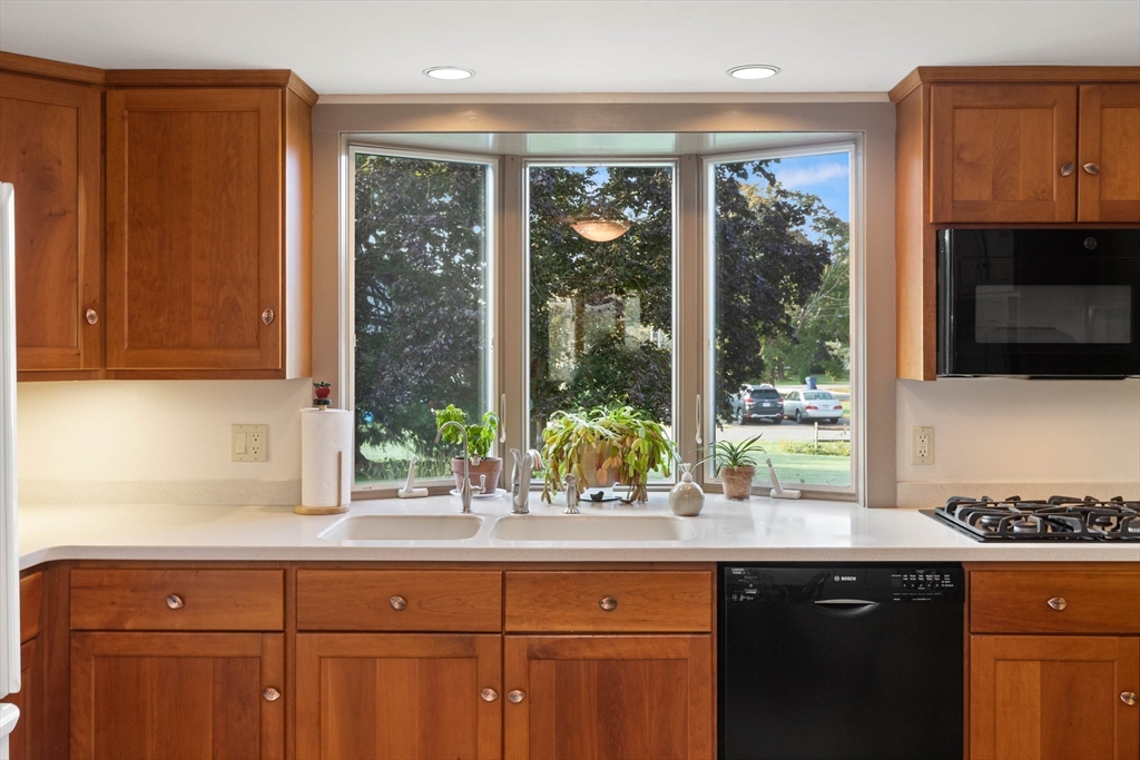 63 Ferry Road Salisbury, MA 01952 - Photo 22 of 42 a sink with a large window and cabinets