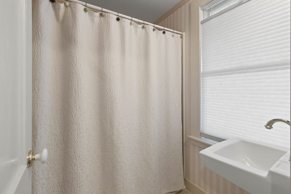 63 Ferry Road Salisbury, MA 01952 - Photo 29 of 42 a bathroom with a sink and a bathtub