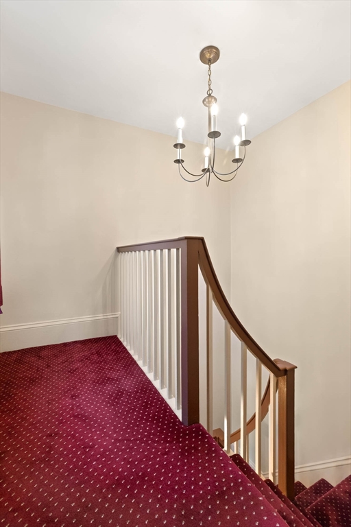 63 Ferry Road Salisbury, MA 01952 - Photo 31 of 42 a view of a hallway with wooden floor and staircase