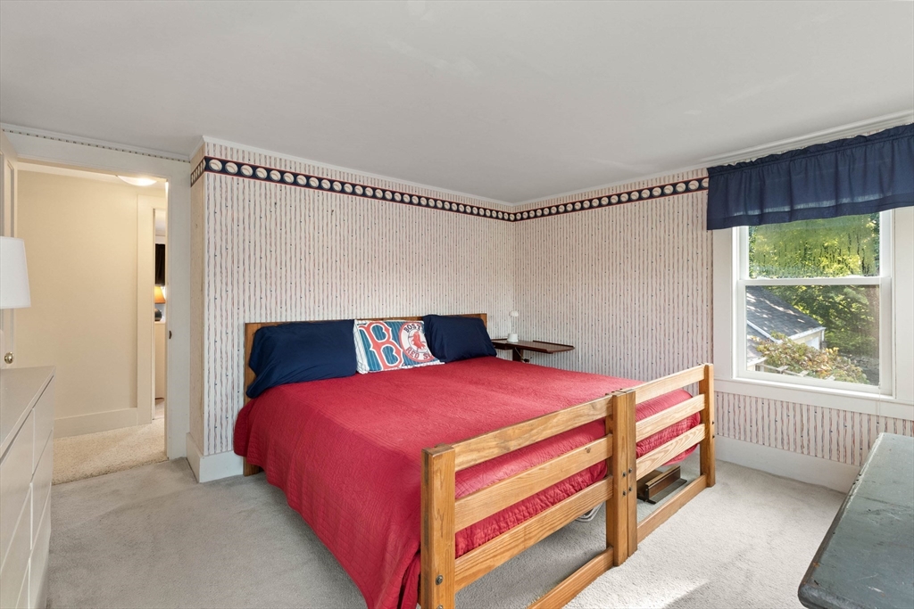 63 Ferry Road Salisbury, MA 01952 - Photo 33 of 42 a bedroom with a bed and a window