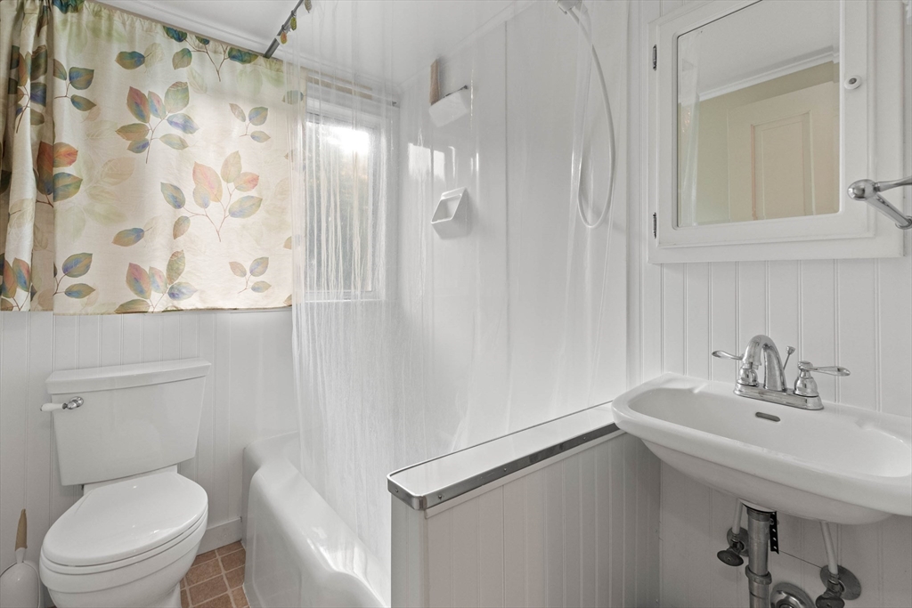 63 Ferry Road Salisbury, MA 01952 - Photo 34 of 42 a bathroom with a sink toilet and shower