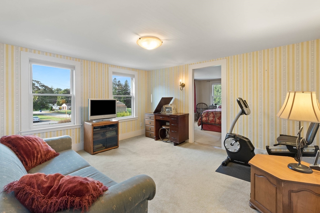 63 Ferry Road Salisbury, MA 01952 - Photo 38 of 42 a living room with furniture a flat screen tv and a window