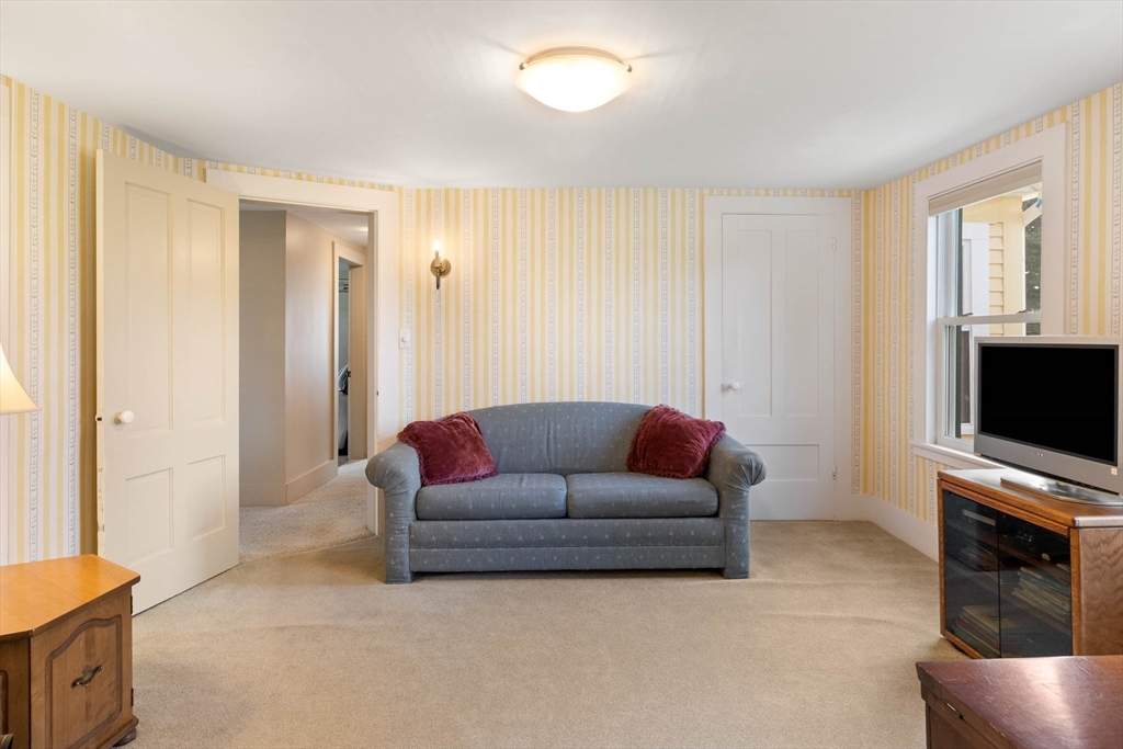 63 Ferry Road Salisbury, MA 01952 - Photo 40 of 42 a living room with furniture and a flat screen tv