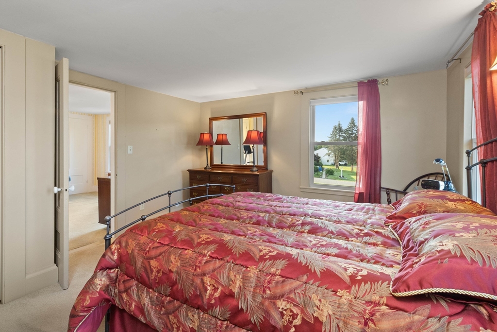 63 Ferry Road Salisbury, MA 01952 - Photo 41 of 42 a bedroom with a bed and a dresser next to a window