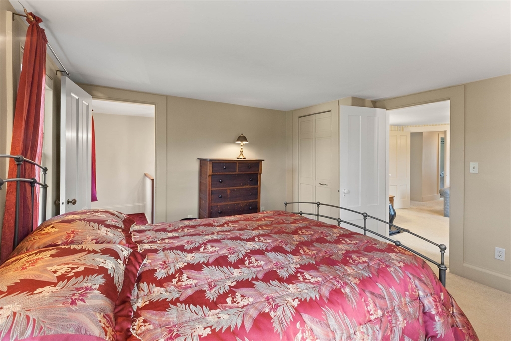 63 Ferry Road Salisbury, MA 01952 - Photo 42 of 42 a bedroom with a large bed and a dresser
