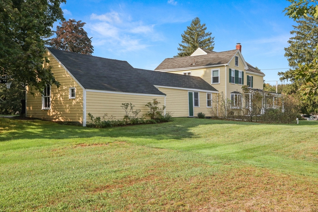63 Ferry Road Salisbury, MA 01952 - Photo 7 of 42 a front view of a house with a garden