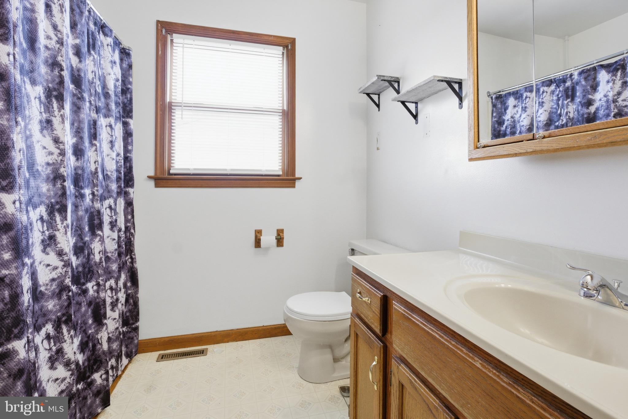 1302 Carbon Street Reading, PA 19601 - Photo 15 of 24 a bathroom with a sink and a toilet