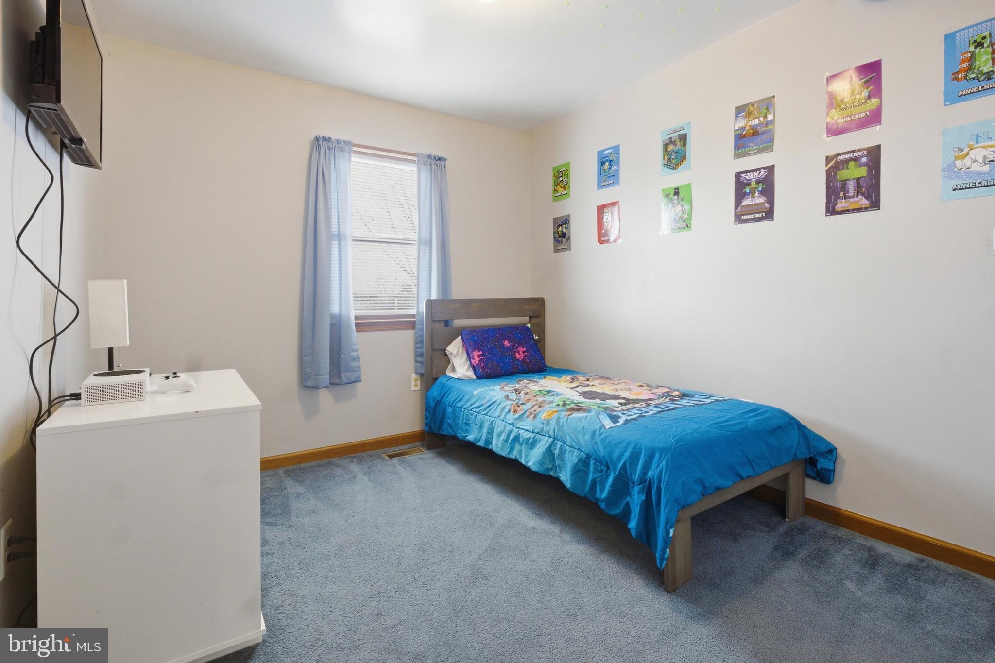 1302 Carbon Street Reading, PA 19601 - Photo 16 of 24 a bedroom with a bed and a window