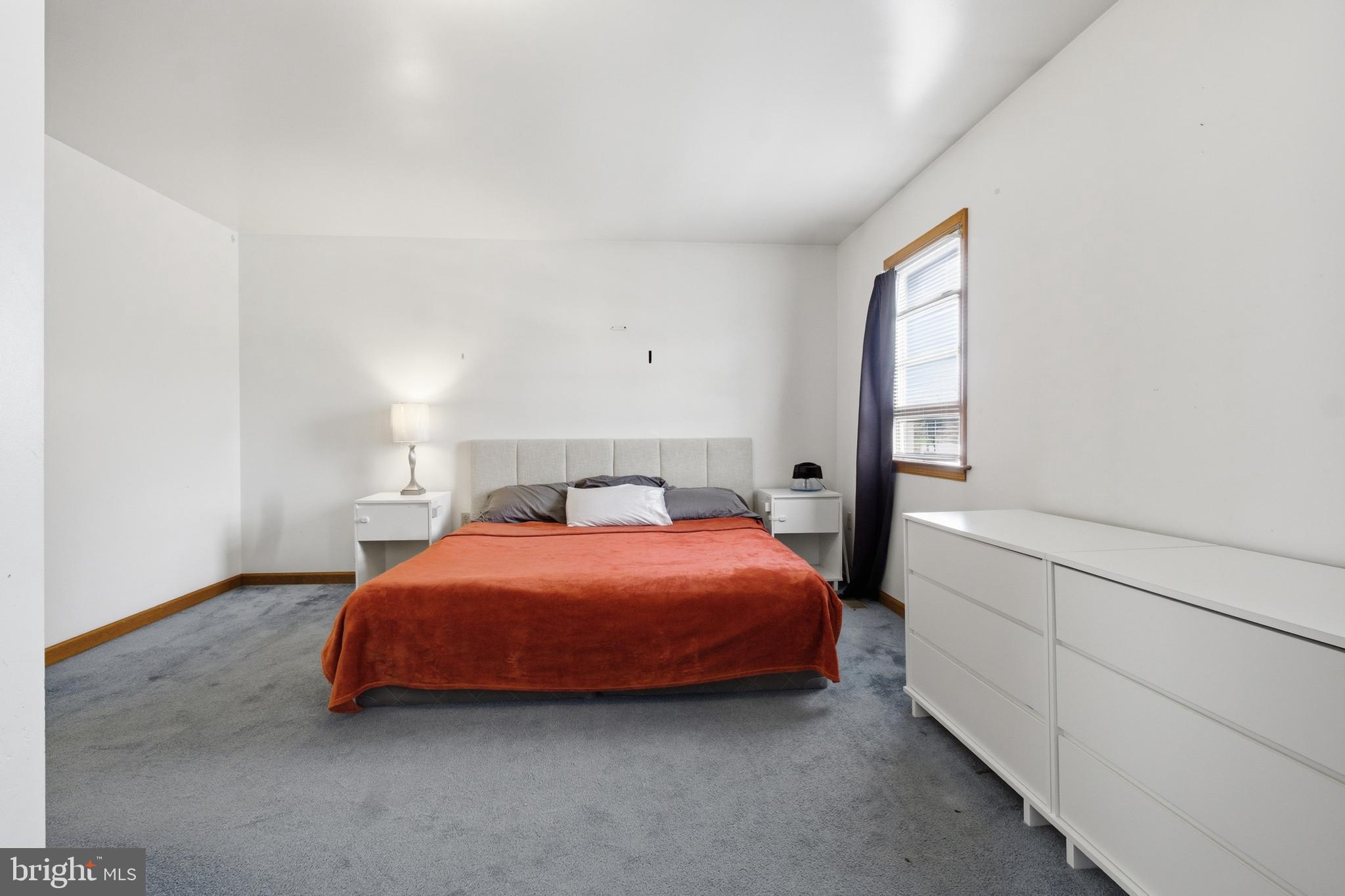 1302 Carbon Street Reading, PA 19601 - Photo 20 of 24 a bedroom with a bed and window