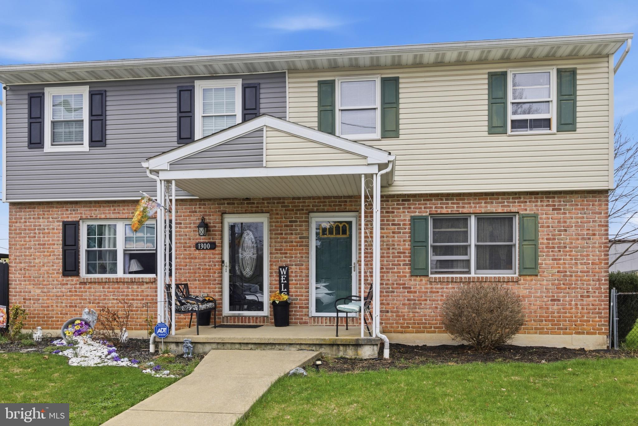 1302 Carbon Street Reading, PA 19601 - Photo 2 of 24 front view of a house with a yard