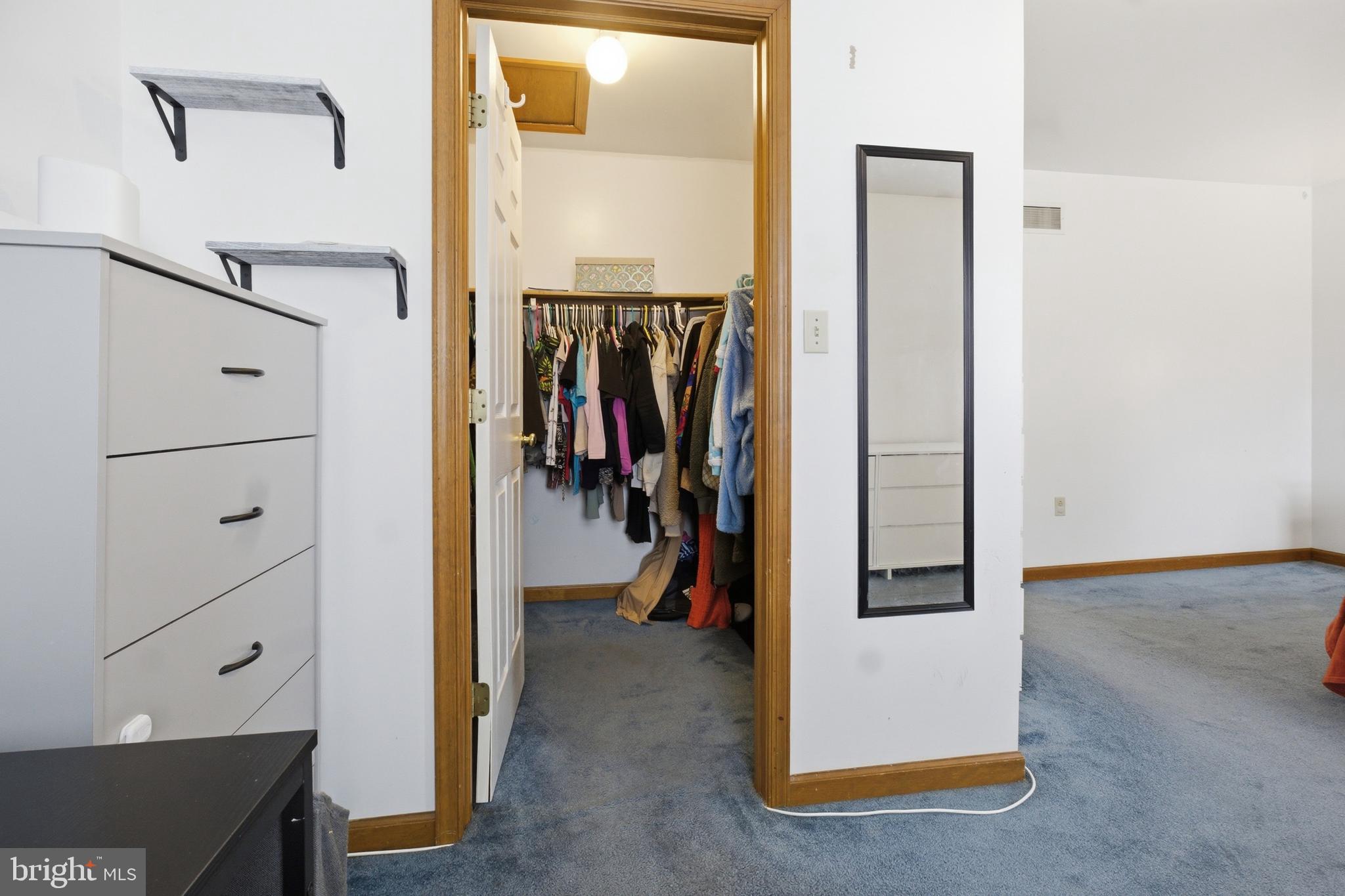 1302 Carbon Street Reading, PA 19601 - Photo 21 of 24 a view of walk in closet with clothes and shoes