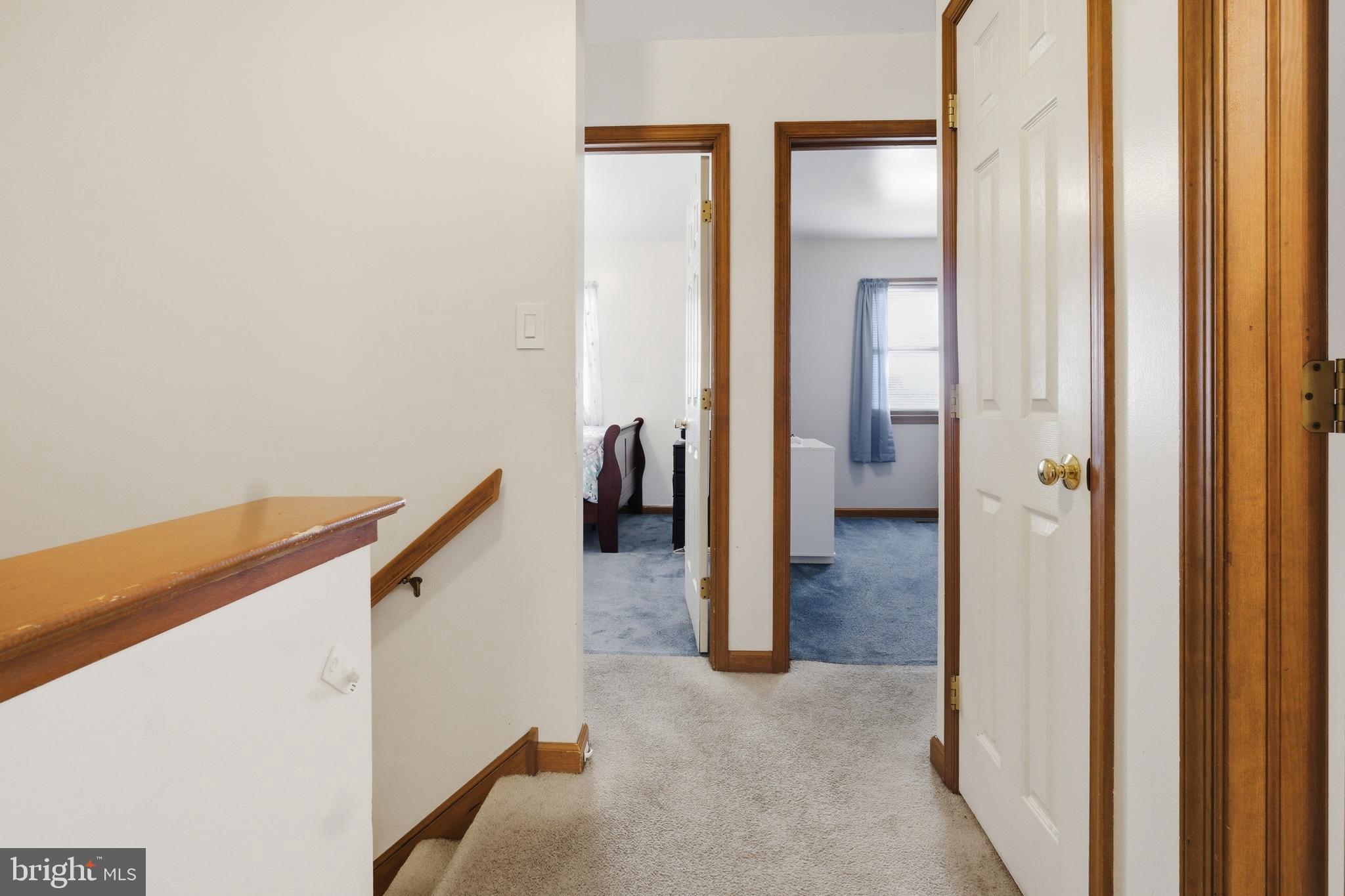 1302 Carbon Street Reading, PA 19601 - Photo 22 of 24 a view of a hallway with wooden floor and staircase