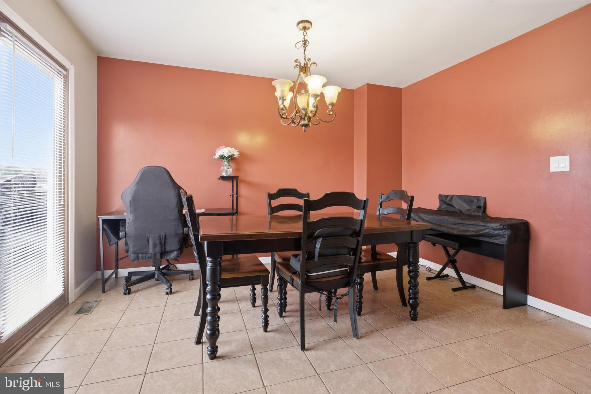 1302 Carbon Street Reading, PA 19601 - Photo 9 of 24 a view of a dining room with furniture and chandelier