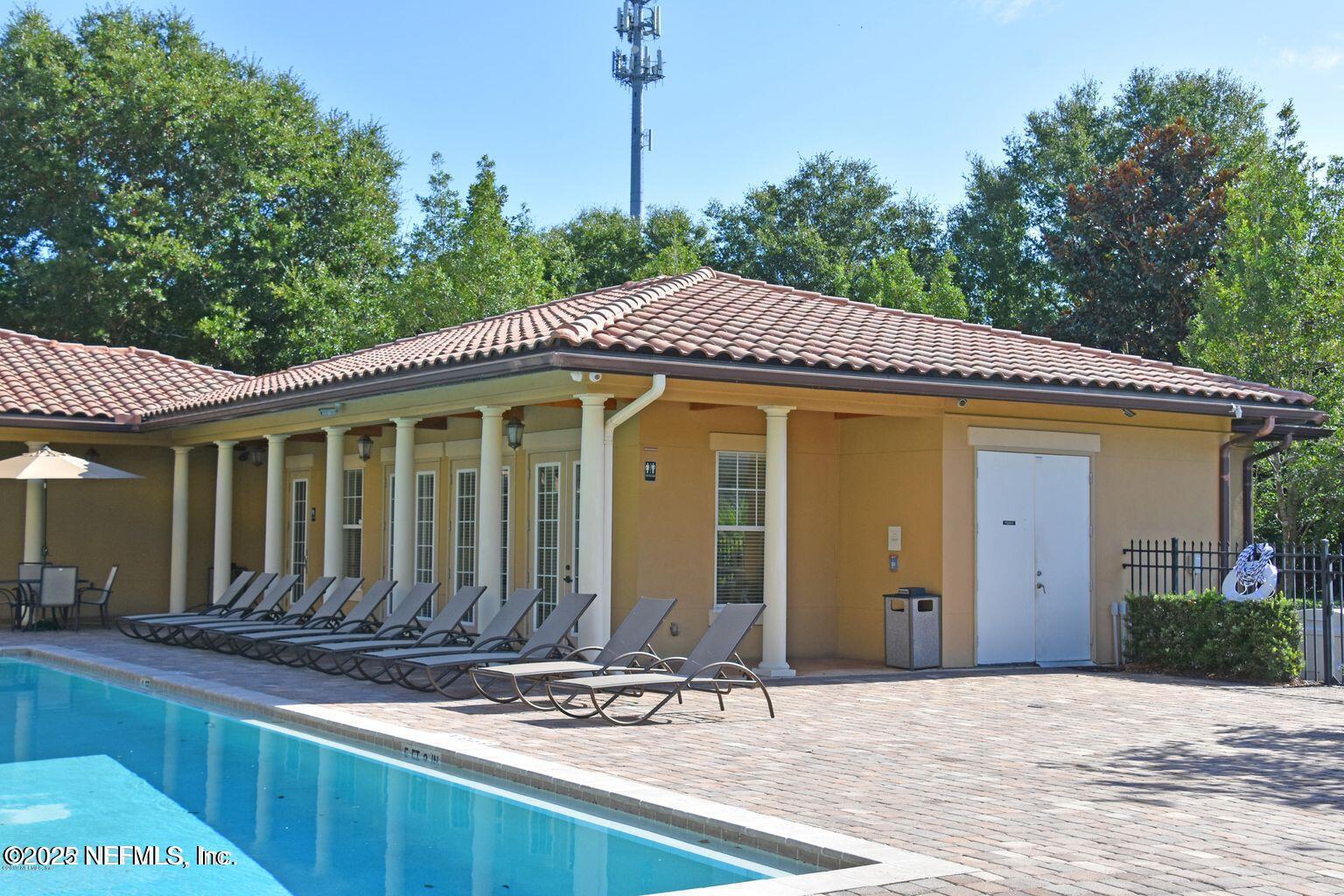 4300 South Beach Parkway, Unit 1314 Jacksonville Beach, FL 32250 - Photo 12 of 16 a front view of a house with garden