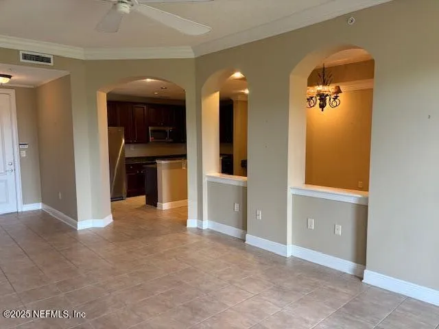 wooden floor in a room with a large window