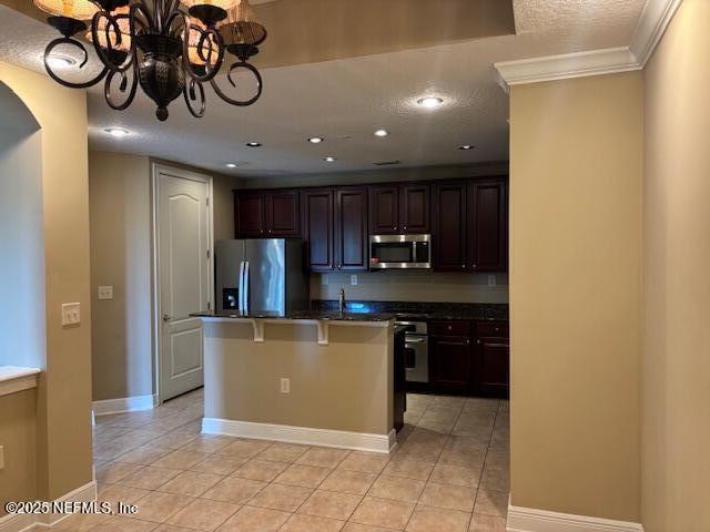 4300 South Beach Parkway, Unit 1314 Jacksonville Beach, FL 32250 - Photo 5 of 16 a kitchen with stainless steel appliances granite countertop a refrigerator a stove and a sink