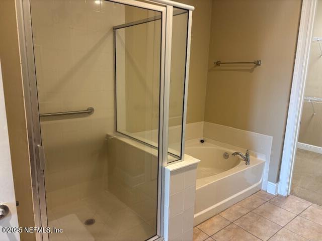 4300 South Beach Parkway, Unit 1314 Jacksonville Beach, FL 32250 - Photo 9 of 16 a spacious bathroom with a bathtub and a shower