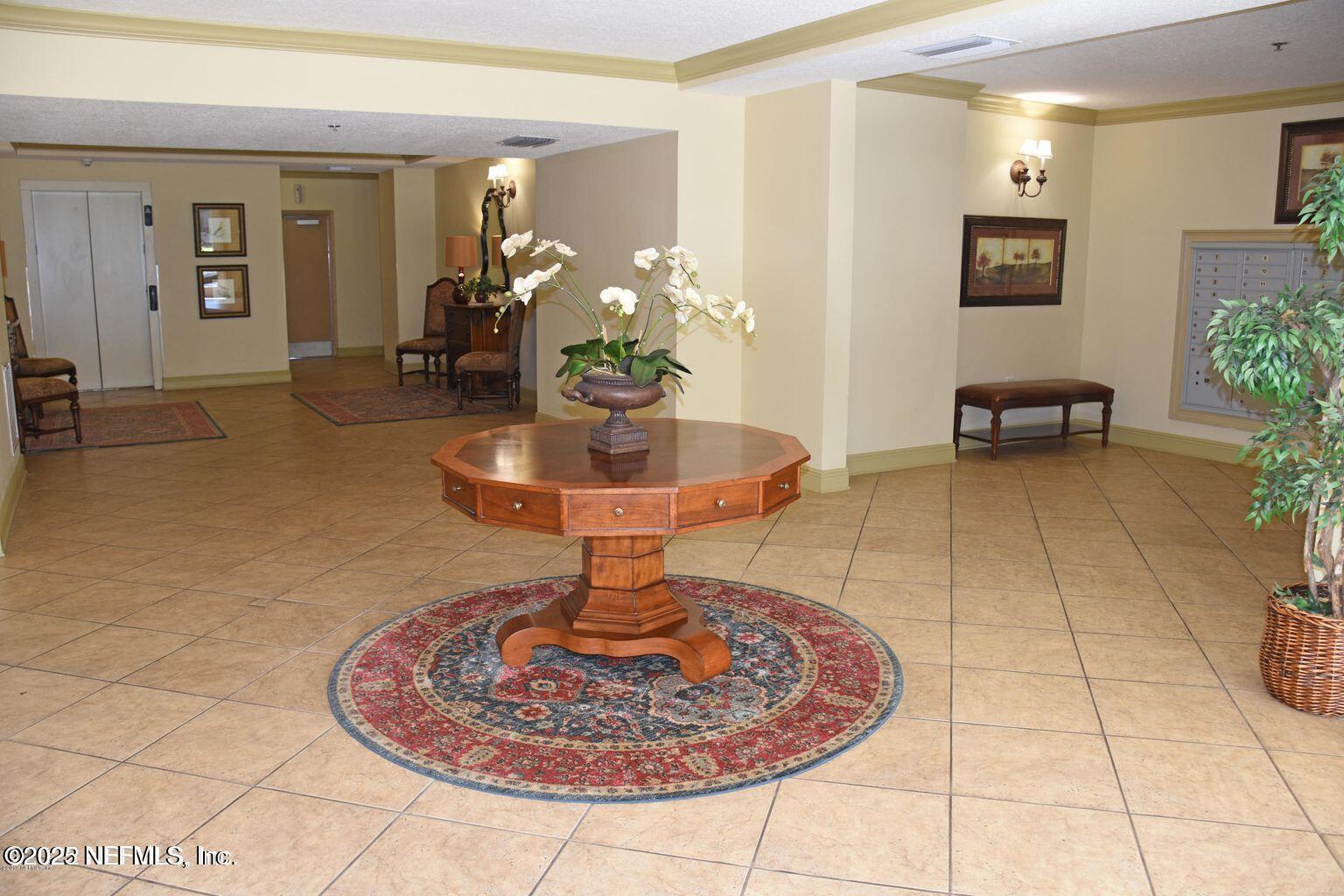 4300 South Beach Parkway, Unit 1314 Jacksonville Beach, FL 32250 - Photo 10 of 16 a vase of flowers sitting on a table