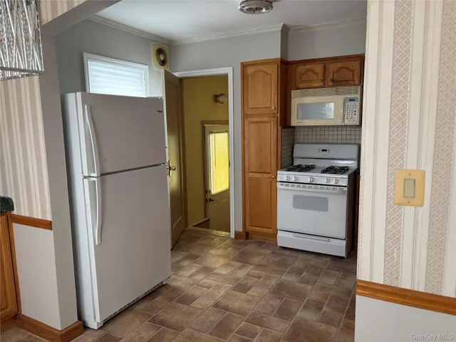a kitchen with a refrigerator sink and stove