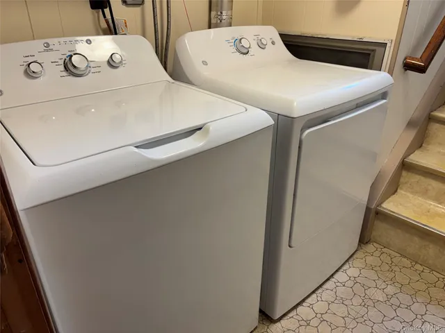 a kitchen with a sink cabinets and stainless steel appliances