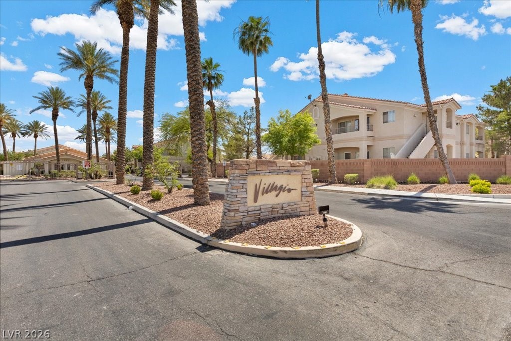 1881 West Alexander Road, Unit 1037 North Las Vegas, NV 89032 - Photo 2 of 31 A welcoming stone monument marks the entrance to this desert oasis community with security gates.