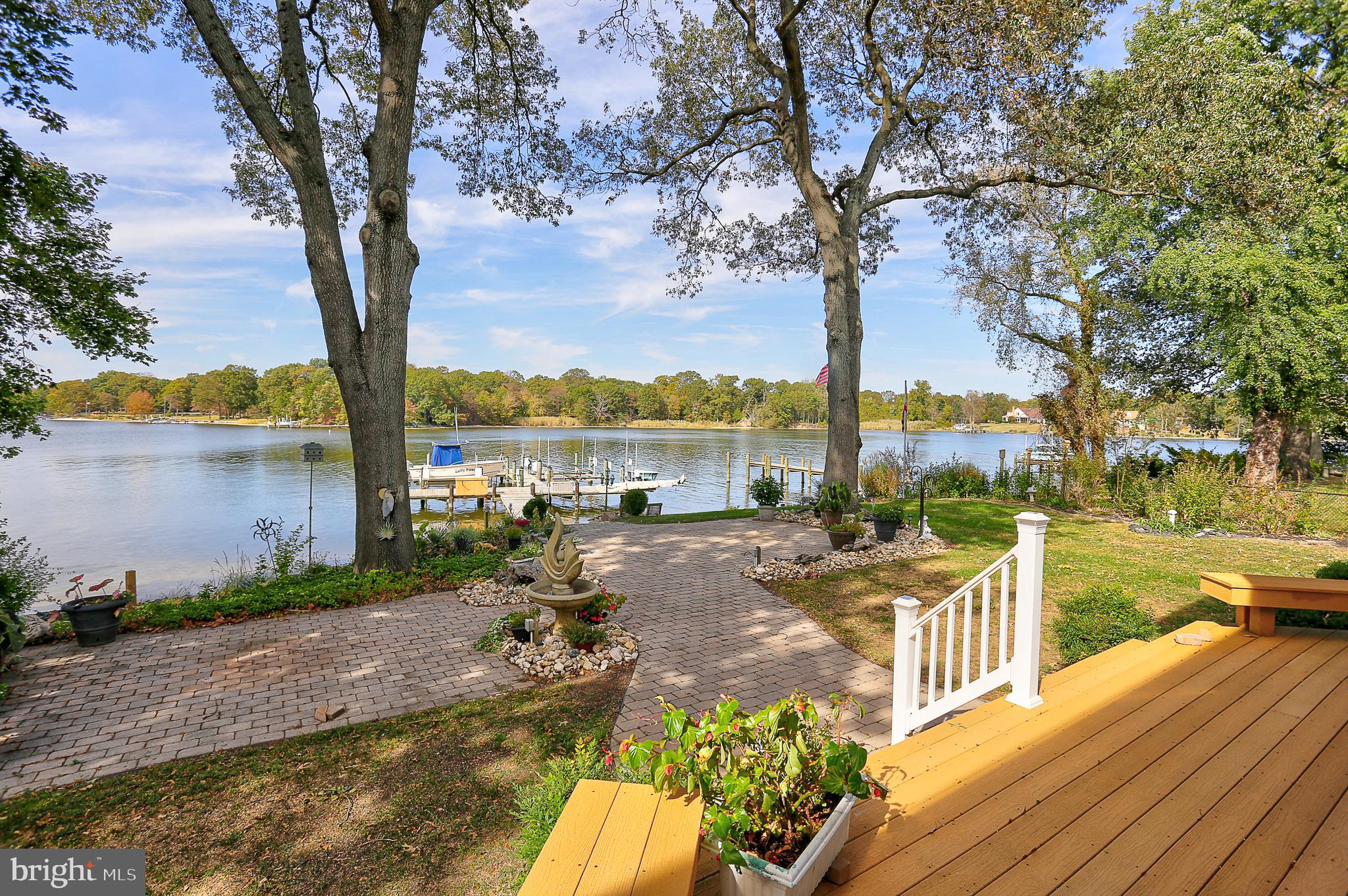 2108 Poplar Ridge Road Pasadena, MD 21122 - Photo 10 of 15 Waterfront deck steps down to pavered patio