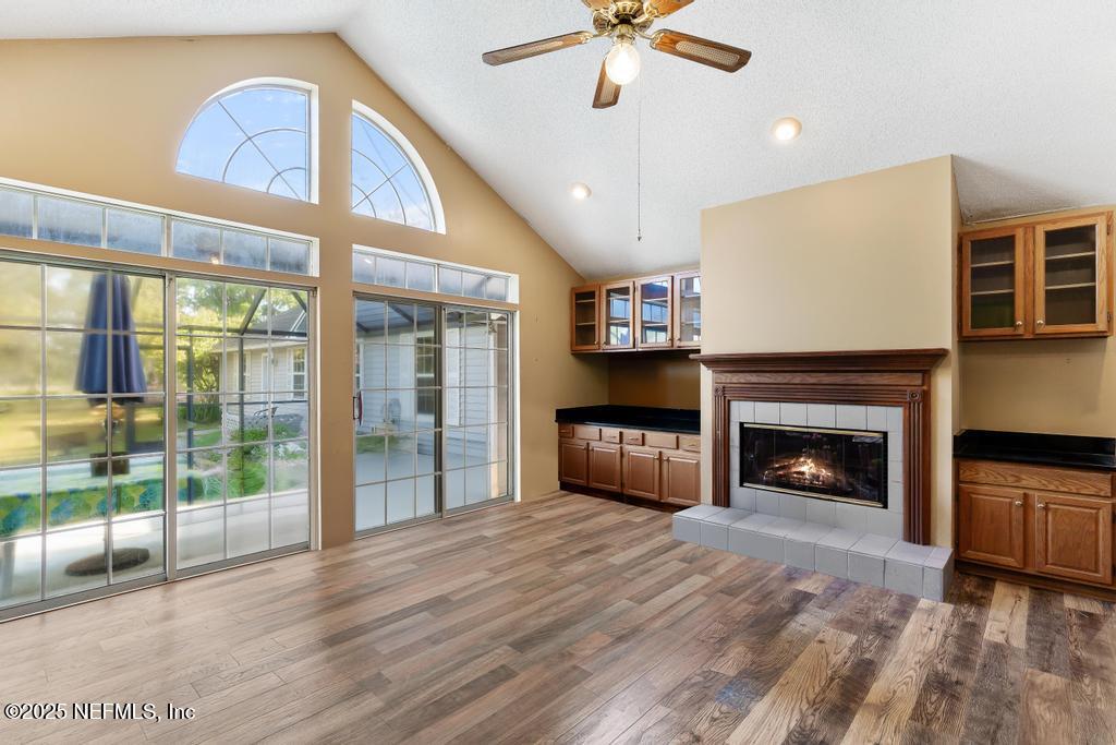 45235 Stratton Road Callahan, FL 32011 - Photo 13 of 44 a view of an empty room with a fireplace and a window