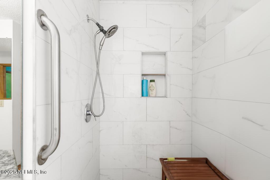 45235 Stratton Road Callahan, FL 32011 - Photo 17 of 44 a bathroom with a shower