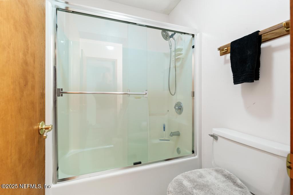 45235 Stratton Road Callahan, FL 32011 - Photo 23 of 44 a bathroom with a shower and a toilet