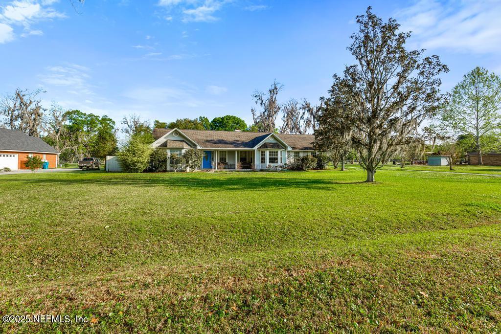 45235 Stratton Road Callahan, FL 32011 - Photo 3 of 44 a view of a house with a big yard