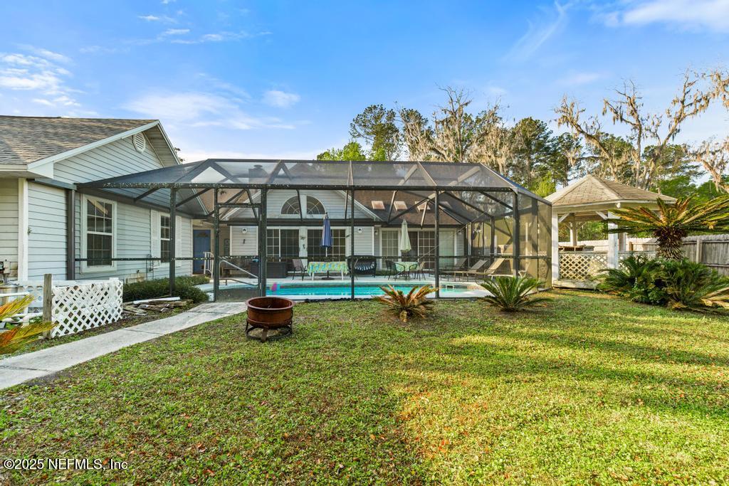 45235 Stratton Road Callahan, FL 32011 - Photo 35 of 44 a garden with trees in the background