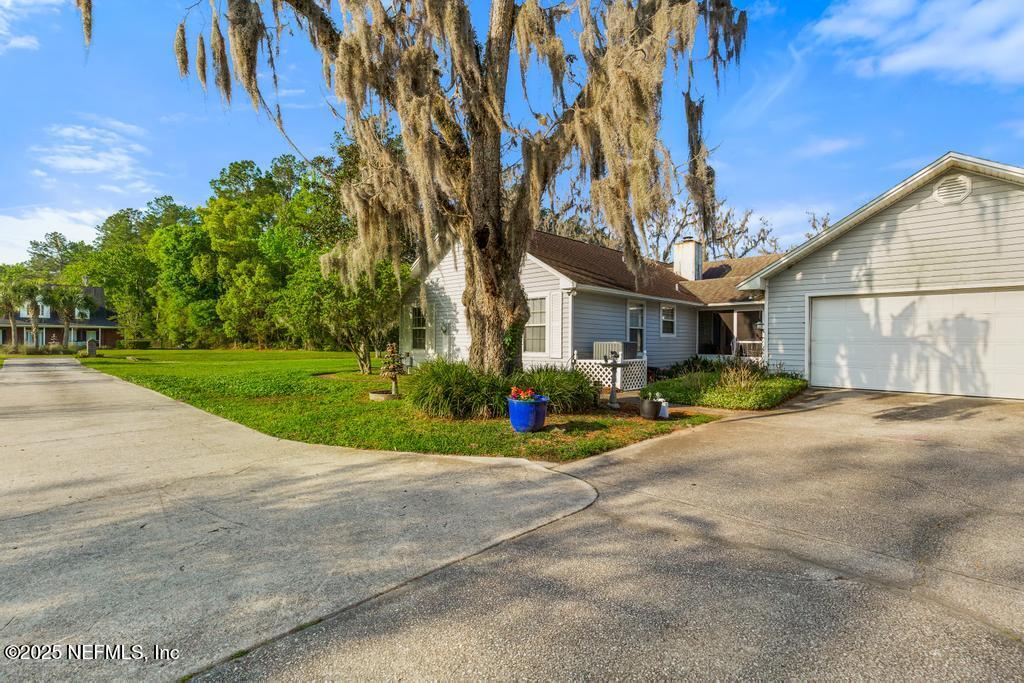 45235 Stratton Road Callahan, FL 32011 - Photo 36 of 44 a view of a house with a yard and pathway