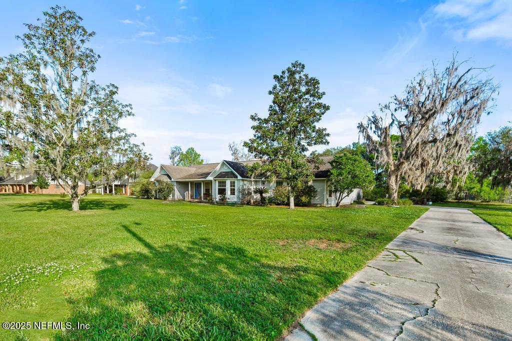 45235 Stratton Road Callahan, FL 32011 - Photo 4 of 44 a front view of a house with a yard