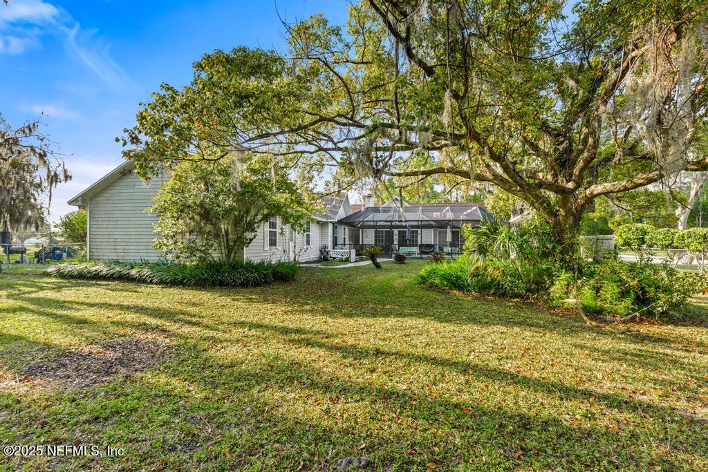 45235 Stratton Road Callahan, FL 32011 - Photo 43 of 44 a front view of a house with a yard