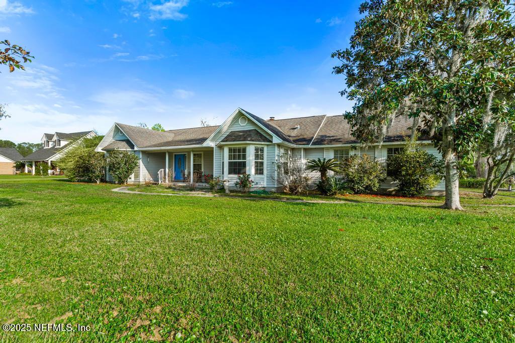 45235 Stratton Road Callahan, FL 32011 - Photo 6 of 44 a front view of a house with a yard