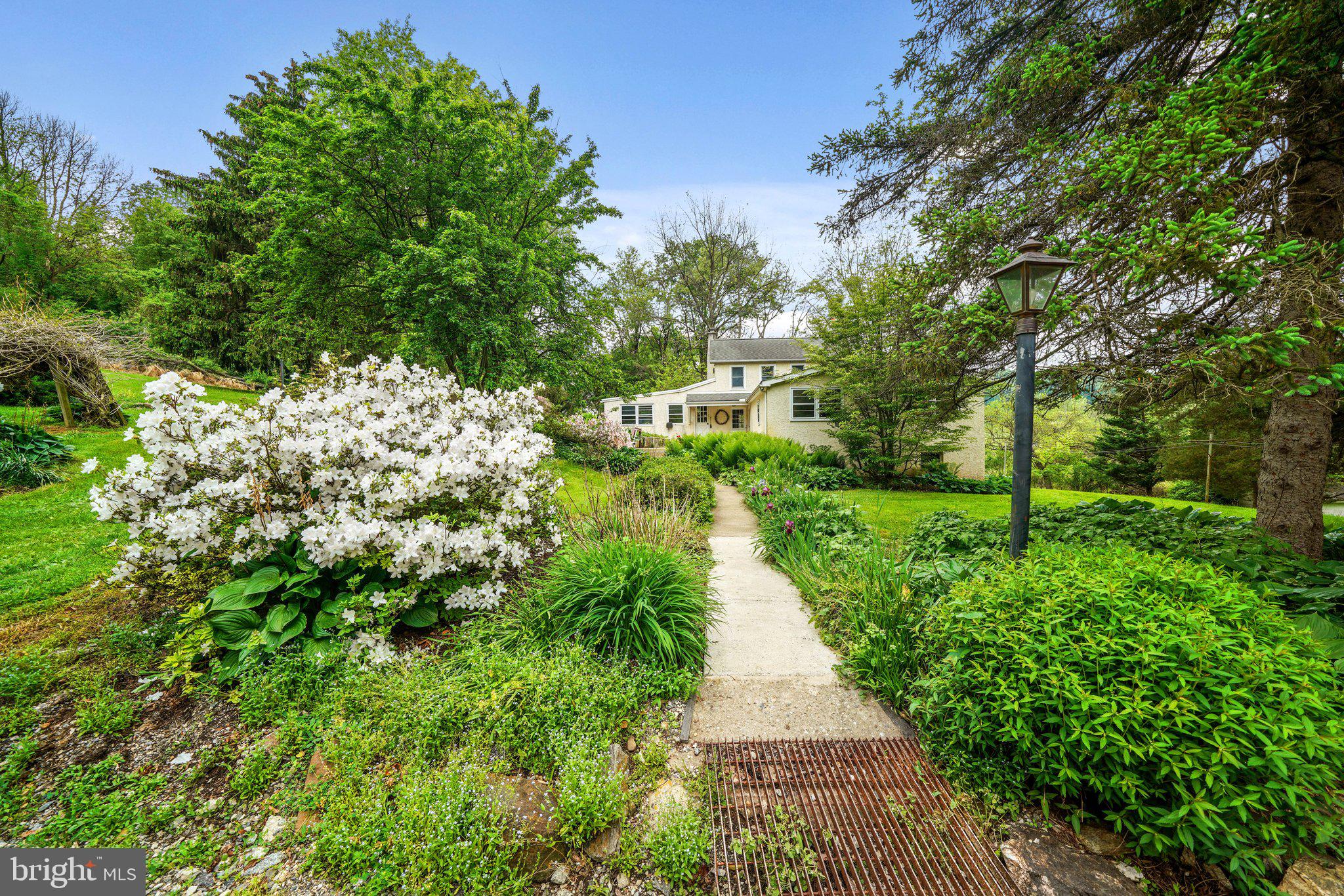 1046 Pike Springs Road Phoenixville, PA 19460 - Photo 16 of 51 Front Walkway with flowering landscaping