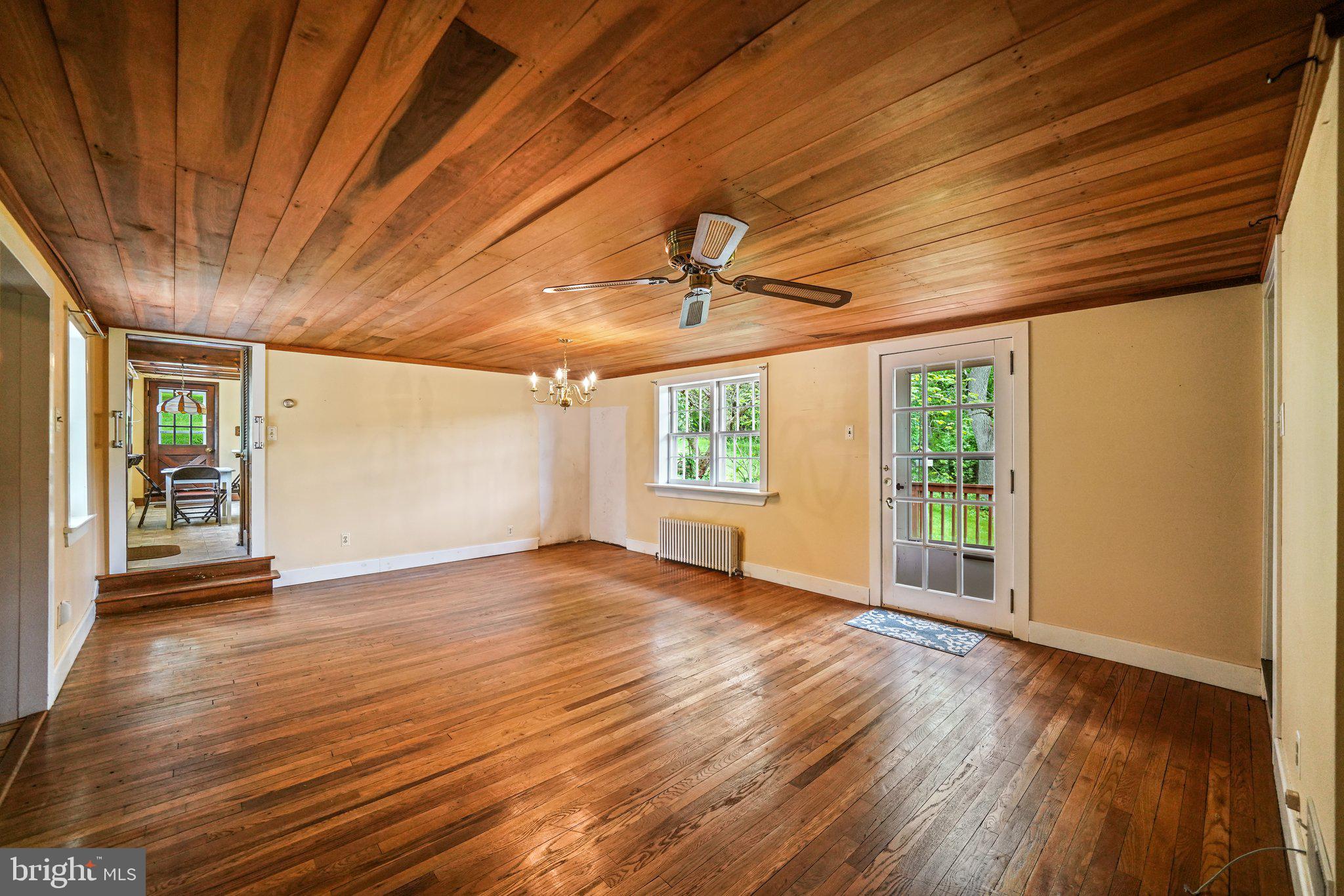 1046 Pike Springs Road Phoenixville, PA 19460 - Photo 34 of 51 Wood floors and ceiling - door leads to back deck