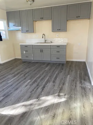 a kitchen with wooden cabinets and sink