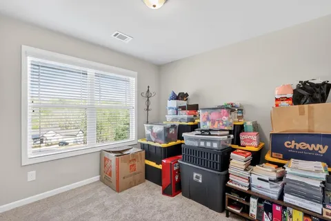a kitchen with a refrigerator and a sink