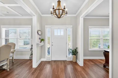 a kitchen with stainless steel appliances granite countertop a sink refrigerator and microwave
