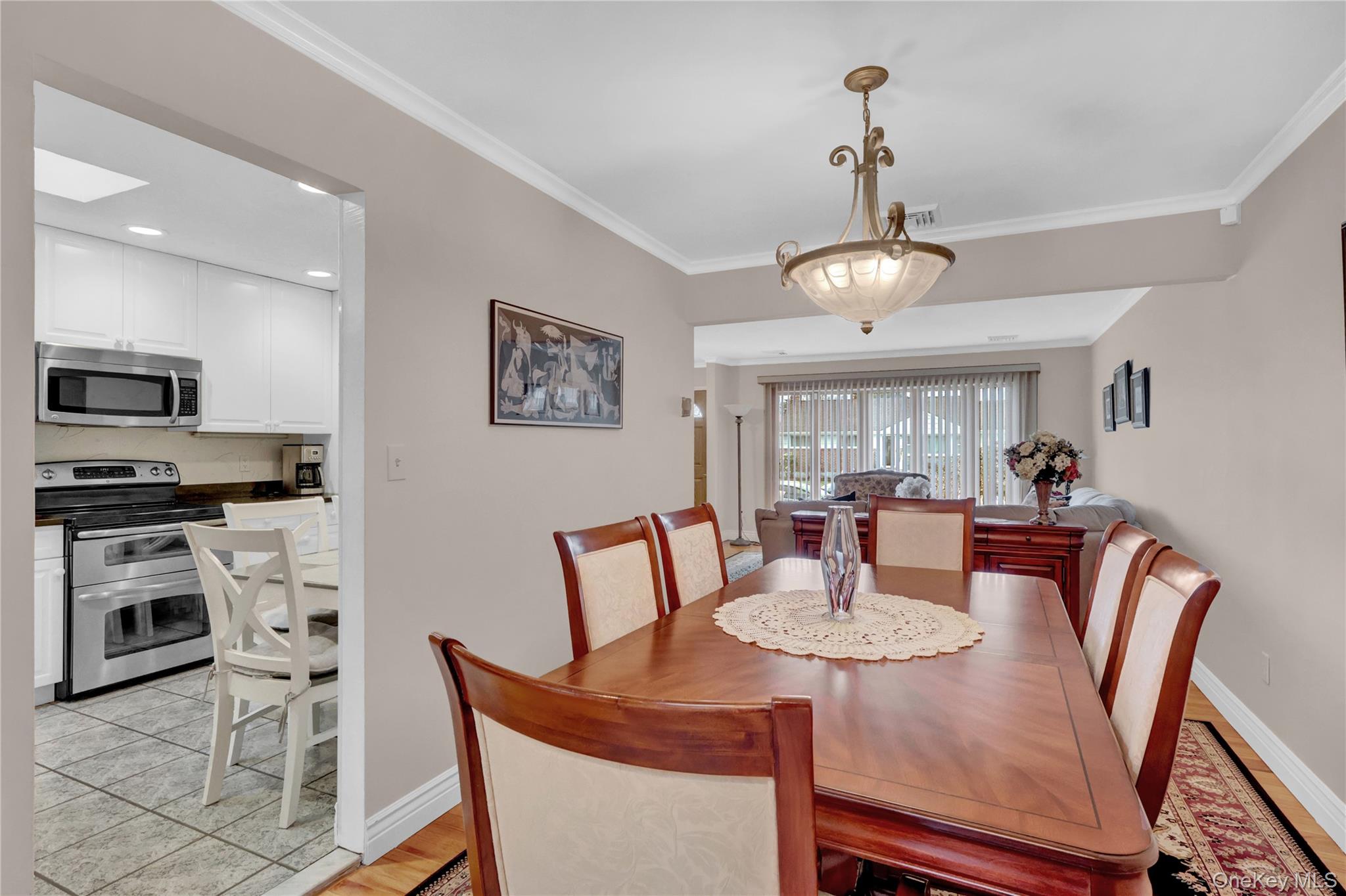 46 Kalda Lane Plainview, NY 11803 - Photo 15 of 30 a view of a dining room with furniture and wooden floor
