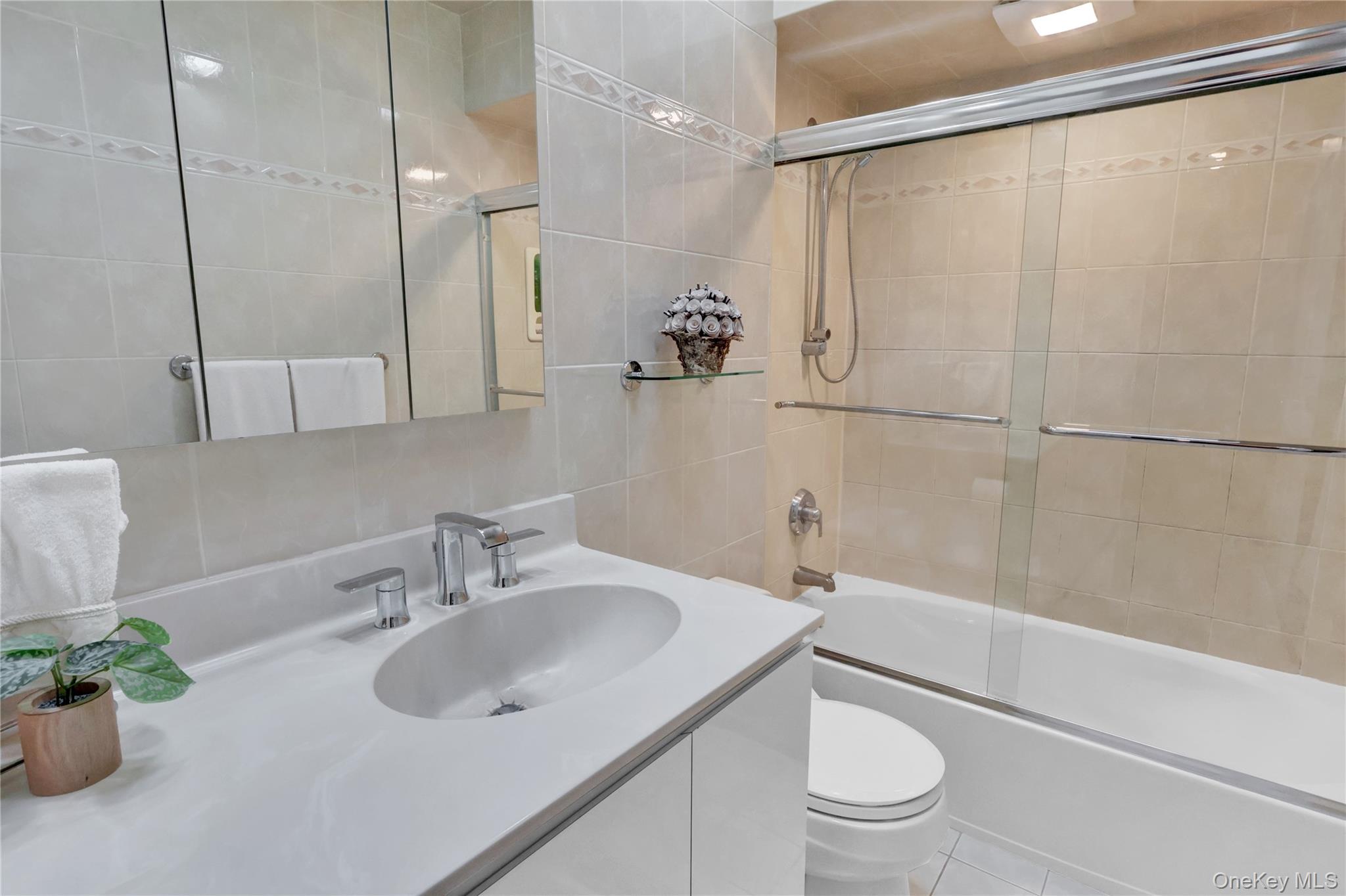 46 Kalda Lane Plainview, NY 11803 - Photo 25 of 30 a bathroom with a sink toilet and shower