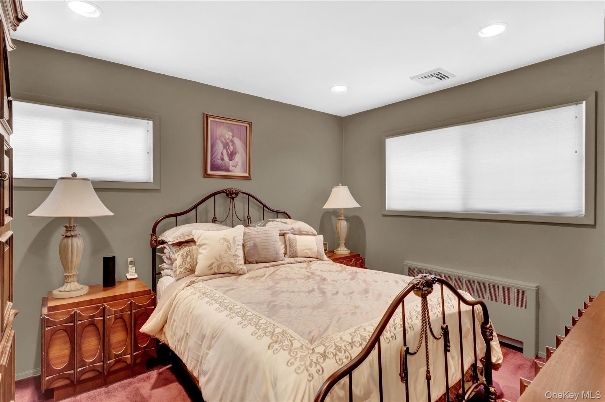 46 Kalda Lane Plainview, NY 11803 - Photo 26 of 30 a bedroom with a bed and a lamp